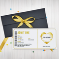 Black envelope with gold ribbon and concert ticket design on a light wooden surface